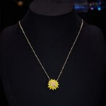 Trendy brass gold plated enamel sunflower jewelry set wholesale featuring a vibrant yellow sunflower pendant with a realistic 3D little honeybee on a delicate chain and matching sunflower stud earrings on junejewelry.com