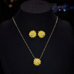 Trendy brass gold plated enamel sunflower jewelry set wholesale featuring a vibrant yellow sunflower pendant with a realistic 3D little honeybee on a delicate chain and matching sunflower stud earrings on junejewelry.com