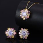 Light luxury colorfast colorful zircon sunflower jewelry set wholesale featuring a brilliant multi-colored crystal cluster halo pendant necklace and matching sunflower stud earrings on a gold and platinum silver base from junejewelry.com.