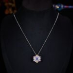Light luxury colorfast colorful zircon sunflower jewelry set wholesale featuring a brilliant multi-colored crystal cluster halo pendant necklace and matching sunflower stud earrings on a gold and platinum silver base from junejewelry.com.