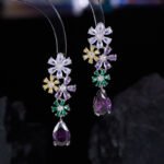 Cross-border high-end colorful zircon flower jewelry set wholesale featuring a cascading multi-colored crystal floral cluster pendant necklace with a dark purple teardrop drop and matching long drop earrings from junejewelry.com.