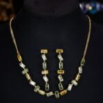 Western light luxury gradient zircon jewelry set wholesale featuring an ombre baguette-cut crystal geometric collar necklace and matching linear drop earrings from junejewelry.com