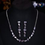 Western light luxury gradient zircon jewelry set wholesale featuring an ombre baguette-cut crystal geometric collar necklace and matching linear drop earrings from junejewelry.com