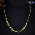 Western light luxury gradient zircon jewelry set wholesale featuring an ombre baguette-cut crystal geometric collar necklace and matching linear drop earrings from junejewelry.com