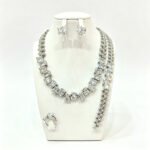 Wholesale square zircon set with emerald-cut clear crystals on real gold plated copper from JuneJewelry.com – luxury bridal jewelry for bulk buyers.