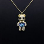Wholesale Crystal Bear Necklace with pink Swarovski element crystals on platinum plated brass from JuneJewelry.com.