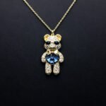 Wholesale Crystal Bear Necklace with pink Swarovski element crystals on platinum plated brass from JuneJewelry.com.