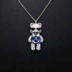 Wholesale Crystal Bear Necklace with pink Swarovski element crystals on platinum plated brass from JuneJewelry.com.