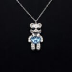 Wholesale Crystal Bear Necklace with pink Swarovski element crystals on platinum plated brass from JuneJewelry.com.