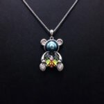 Wholesale Heart Bear Necklace with a crystal heart and pearl on platinum plated brass from JuneJewelry.com.