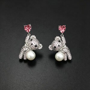 Wholesale Swarovski Bear Earrings featuring pink heart crystals on platinum plated brass from JuneJewelry.com.