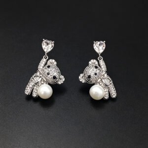 Wholesale Swarovski Bear Earrings featuring pink heart crystals on platinum plated brass from JuneJewelry.com.