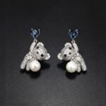 Wholesale Swarovski Bear Earrings featuring pink heart crystals on platinum plated brass from JuneJewelry.com.