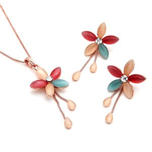 Wholesale Hollow Teardrop Jewelry Set featuring openwork frames and cat eye stones on rose gold zinc alloy from JuneJewelry.com.