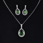 Premium luxury teardrop zircon jewelry set wholesale featuring a solitaire pear-cut pendant necklace, drop earrings, and halo ring on junejewelry.com