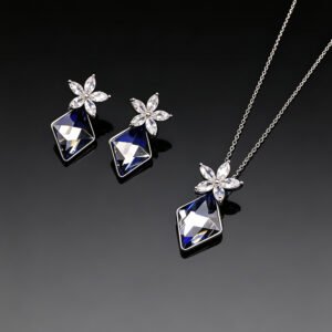 Wholesale crystal jewelry set made of white gold plated copper with floral details and geometric Swarovski element crystals from JuneJewelry.com.