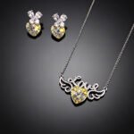 Wholesale butterfly jewelry set made of white gold plated copper with purple and golden Swarovski element crystals from JuneJewelry.com.
