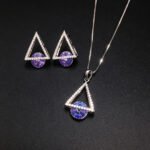 Wholesale geometric jewelry set featuring white gold plated copper with pink Swarovski element crystals from JuneJewelry.com.