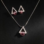 Wholesale geometric jewelry set featuring white gold plated copper with pink Swarovski element crystals from JuneJewelry.com.