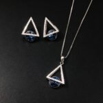 Wholesale geometric jewelry set featuring white gold plated copper with pink Swarovski element crystals from JuneJewelry.com.