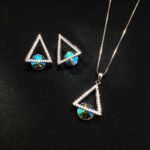 Wholesale geometric jewelry set featuring white gold plated copper with pink Swarovski element crystals from JuneJewelry.com.