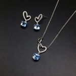 Wholesale heart jewelry set crafted from white gold plated copper with pink Swarovski element crystals from JuneJewelry.com.