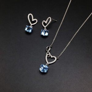 Wholesale heart jewelry set crafted from white gold plated copper with pink Swarovski element crystals from JuneJewelry.com.