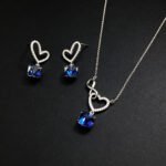 Wholesale heart jewelry set crafted from white gold plated copper with pink Swarovski element crystals from JuneJewelry.com.