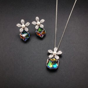 Wholesale flower jewelry set crafted from white gold plated copper with blue Swarovski element crystals and faux pearls from JuneJewelry.com.