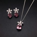 Wholesale flower jewelry set crafted from white gold plated copper with blue Swarovski element crystals and faux pearls from JuneJewelry.com.