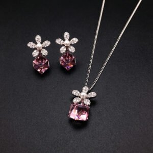 Wholesale flower jewelry set crafted from white gold plated copper with blue Swarovski element crystals and faux pearls from JuneJewelry.com.