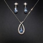 Wholesale teardrop jewelry set crafted from white gold plated copper with iridescent Aurora Borealis Swarovski element crystals from JuneJewelry.com.