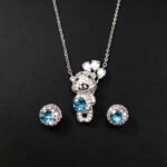 Wholesale teddy jewelry set featuring white gold plated copper with pink Swarovski element crystals from JuneJewelry.com.