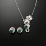 Wholesale teddy jewelry set featuring white gold plated copper with pink Swarovski element crystals from JuneJewelry.com.