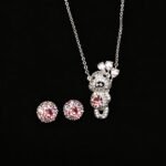 Wholesale teddy jewelry set featuring white gold plated copper with pink Swarovski element crystals from JuneJewelry.com.
