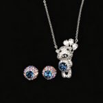 Wholesale teddy jewelry set featuring white gold plated copper with pink Swarovski element crystals from JuneJewelry.com.