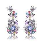 Wholesale floral zircon earrings with clear cubic zirconia petals on platinum plated brass from JuneJewelry.com – bridal chandelier drop earrings for bulk purchase.