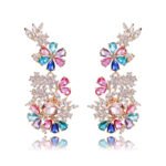 Wholesale floral zircon earrings with clear cubic zirconia petals on platinum plated brass from JuneJewelry.com – bridal chandelier drop earrings for bulk purchase.