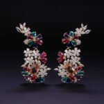 Wholesale floral zircon earrings with clear cubic zirconia petals on platinum plated brass from JuneJewelry.com – bridal chandelier drop earrings for bulk purchase.