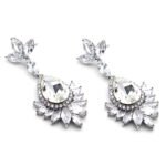 Wholesale teardrop crystal earrings with dark blue Swarovski Element crystals on platinum plated brass from JuneJewelry.com – statement dangle earrings for bulk purchase.