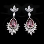 Wholesale teardrop crystal earrings with dark blue Swarovski Element crystals on platinum plated brass from JuneJewelry.com – statement dangle earrings for bulk purchase.