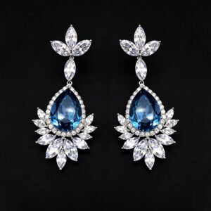 Wholesale teardrop crystal earrings with dark blue Swarovski Element crystals on platinum plated brass from JuneJewelry.com – statement dangle earrings for bulk purchase.