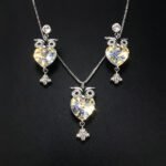Wholesale owl jewelry set made of white gold plated copper with purple heart Swarovski element crystals from JuneJewelry.com.
