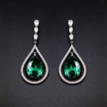 Wholesale waterdrop crystal earrings with blue Swarovski Element crystals in platinum plated brass from JuneJewelry.com – luxury dangle earrings for bulk orders.