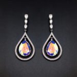 Wholesale waterdrop crystal earrings with blue Swarovski Element crystals in platinum plated brass from JuneJewelry.com – luxury dangle earrings for bulk orders.