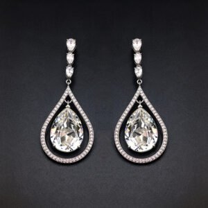 Wholesale waterdrop crystal earrings with blue Swarovski Element crystals in platinum plated brass from JuneJewelry.com – luxury dangle earrings for bulk orders.