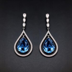 Wholesale waterdrop crystal earrings with blue Swarovski Element crystals in platinum plated brass from JuneJewelry.com – luxury dangle earrings for bulk orders.