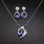 Wholesale crystal jewelry set featuring white gold plated copper with magenta pink teardrop Swarovski element crystals from JuneJewelry.com.