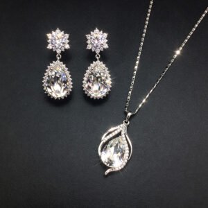 Wholesale crystal jewelry set featuring white gold plated copper with magenta pink teardrop Swarovski element crystals from JuneJewelry.com.