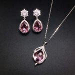 Wholesale crystal jewelry set featuring white gold plated copper with magenta pink teardrop Swarovski element crystals from JuneJewelry.com.